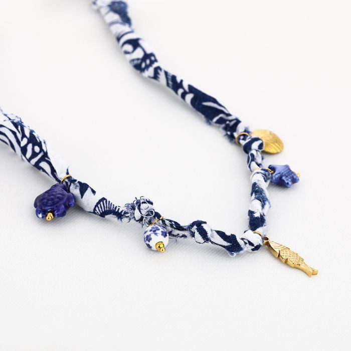 Stoffen bedelketting vis
